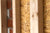 Wooden studs on an unfinished wall.